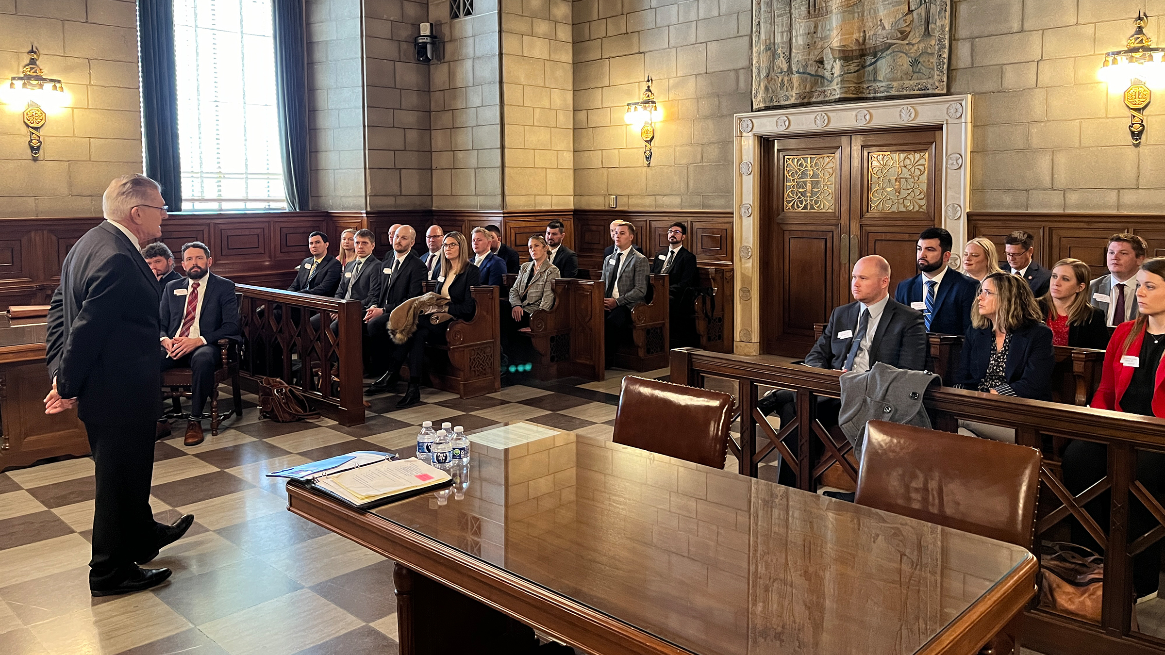 Nebraska LEAD 42 Fellows listening to a speaker at the state capitol during the Political Process seminar.