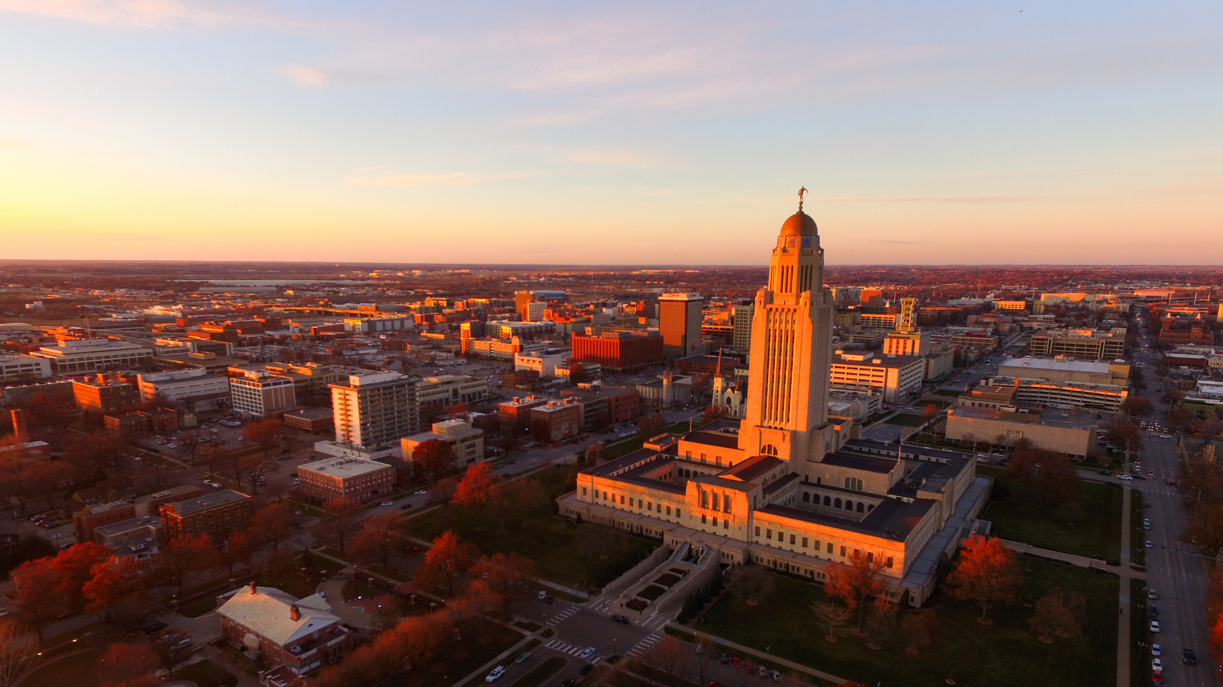 Aerial photo of Lincoln with the Nebraska State Capitol featured. 