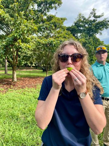 Rachel Prosser samples a lime following a “miracle fruit” berry. Miracle fruit are unique to this region. Their sweet juices temporarily mute sour and salty flavor receptors making any subsequent food consumed taste sweet. 