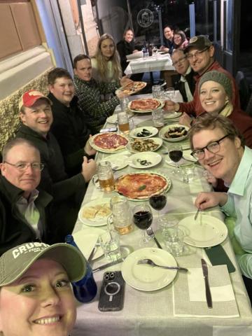 Fellows enjoy local pizza and charcuterie boards after their day of tours. 