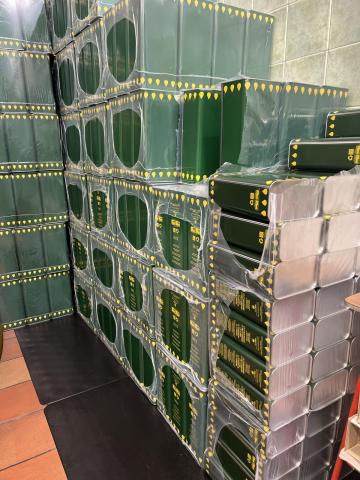 Liters of packaged olive oil in bulk packaging.