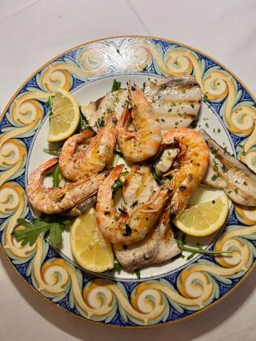 A plate of shrimp and fish.
