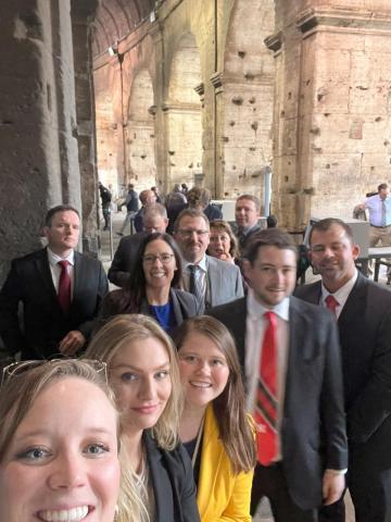 A group of fellows inside the entrance to the Colosseum, ready to see the inside! 