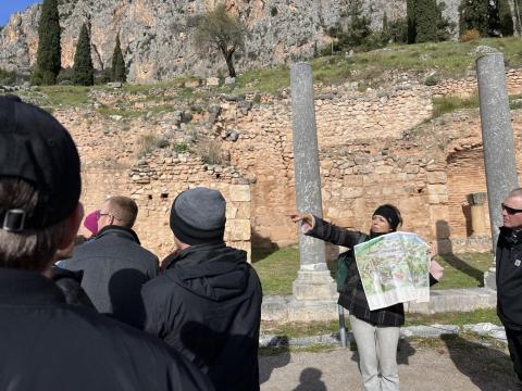 A group near greek ruins.
