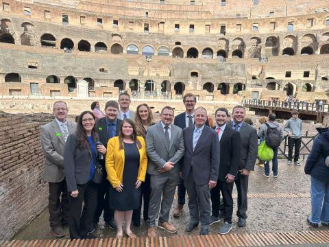 Fellows pose inside the Colosseum.