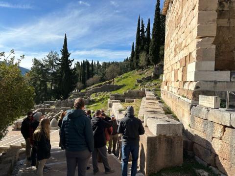 A group near greek ruins.