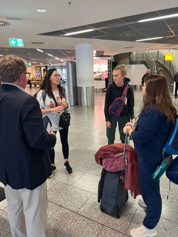 Dr. Terry Hejny discusses his plane ride with fellows Kari Christenson, Anna Shadbolt and Amanda Berg
