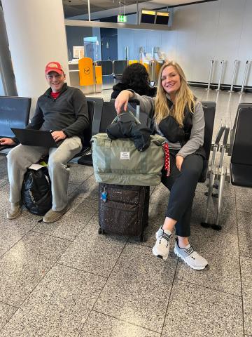 Fellows Jon Lechtenberg and Allissa Troyer enjoy time before their last flight to Tirana.