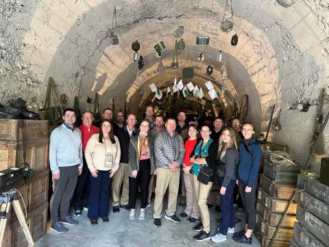 Fellows pose inside a tunnel on the grounds of Kazerma Cereni that is used as a private museum. 