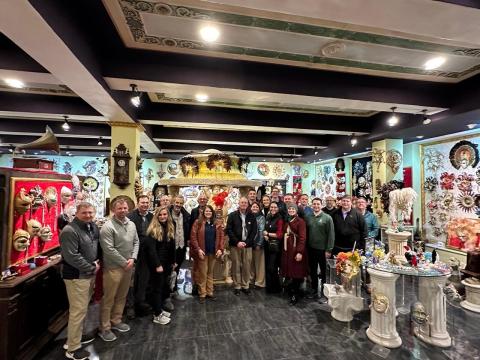Fellows pose with the creator and owner of the Venetian mask factory. These masks can also be found in Las Vegas, USA!